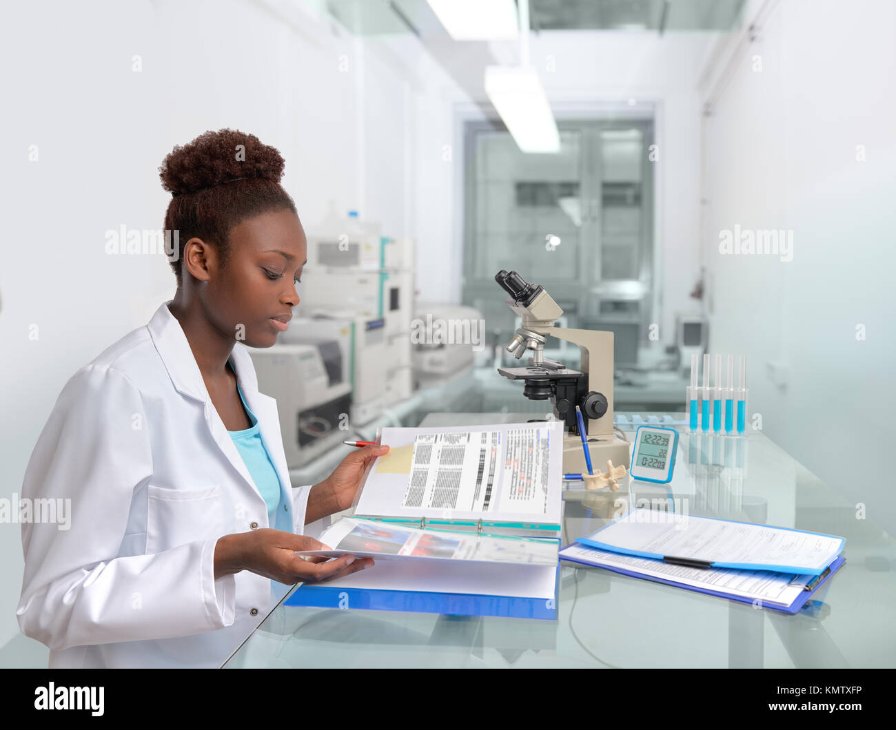African scientist, medical worker, tech or graduate student works in modern biological laboratory Stock Photo