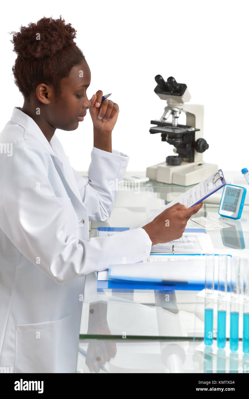 African biologist, medical student or doctor checks records. Focus on the face and eyelashes, top of the piture isolated on white. Stock Photo