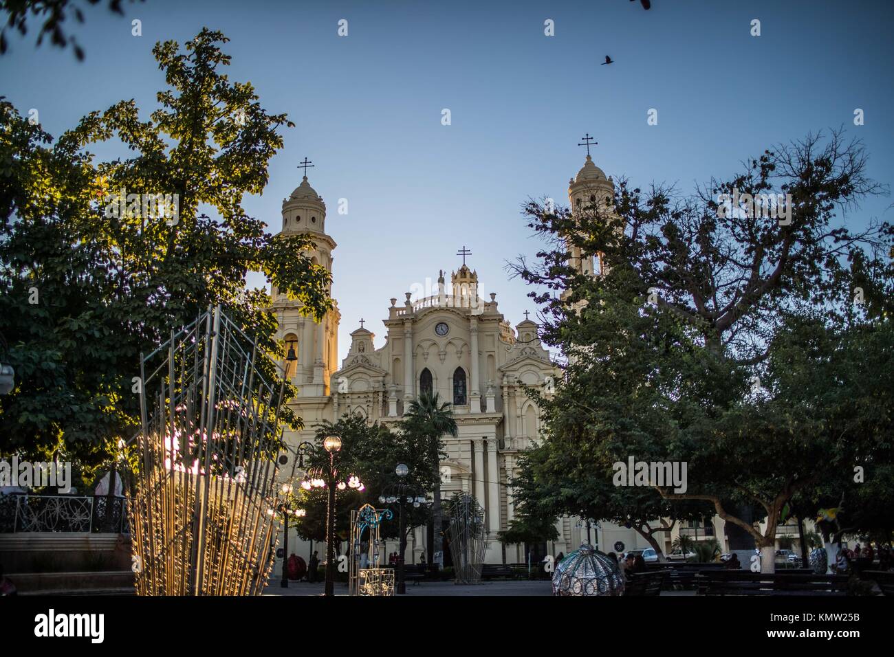 Cathedral of Hermosillo and kiosk of Zaragoza square at sunset. You live the tranquility. Centenario colony and center of Hermosillo, Sonora, Mexico. Stock Photo