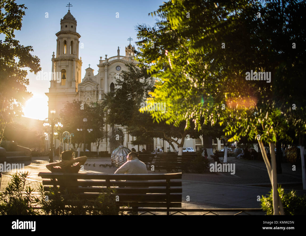 Cathedral of Hermosillo and kiosk of Zaragoza square at sunset. You live the tranquility. Centenario colony and center of Hermosillo, Sonora, Mexico. Stock Photo
