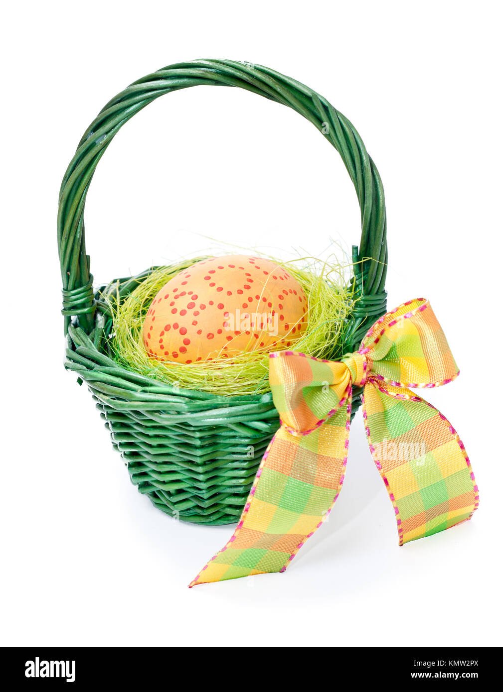 Orange Easter Egg with point circles in a green straw basket with a bow isolated on white Stock Photo