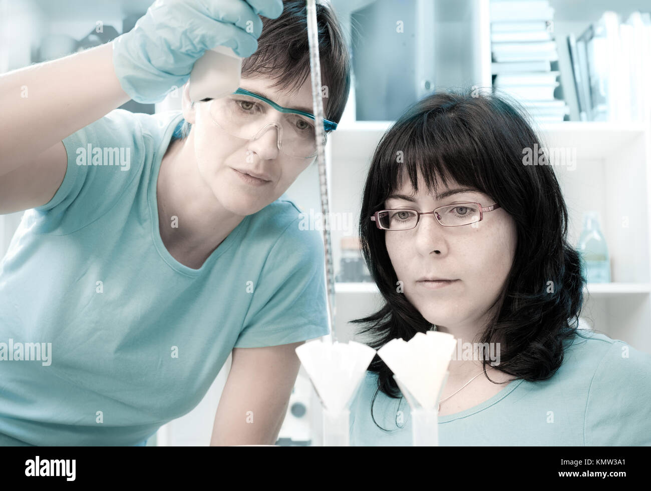 Two female scientists make maxiprep in the lab Stock Photo