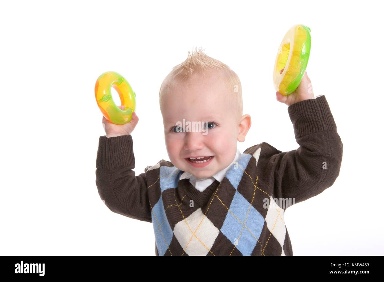Toddler Boy Is Showing To Plastic Yellow Toy Rings Stock Photo Alamy