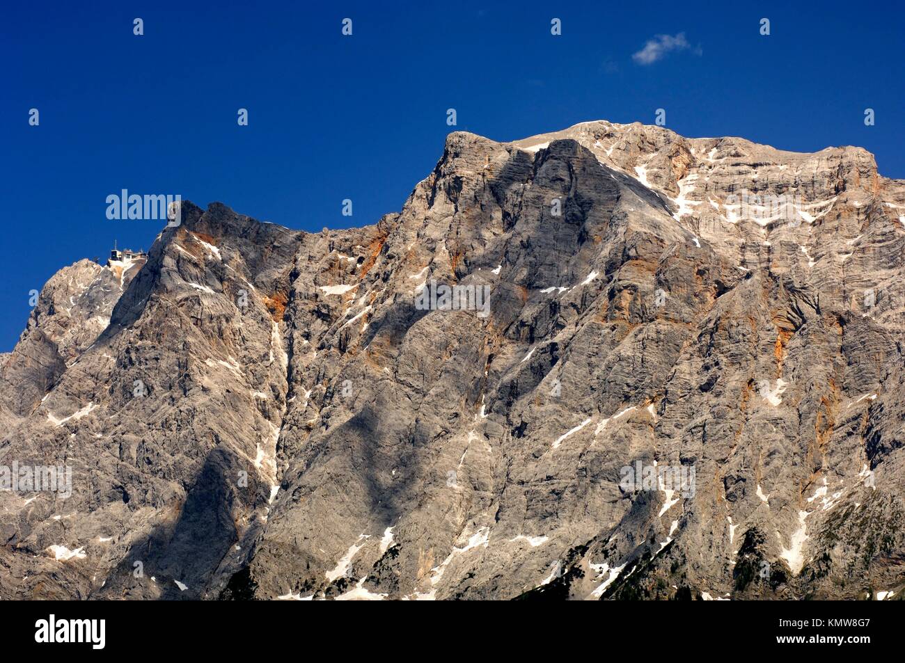 Crest of the Wetterstein mountain range with Mt  Zugspitze and the upper station of the Tyrol Zugspitze cable car, Ehrwald, Tyrol, Austria Stock Photo