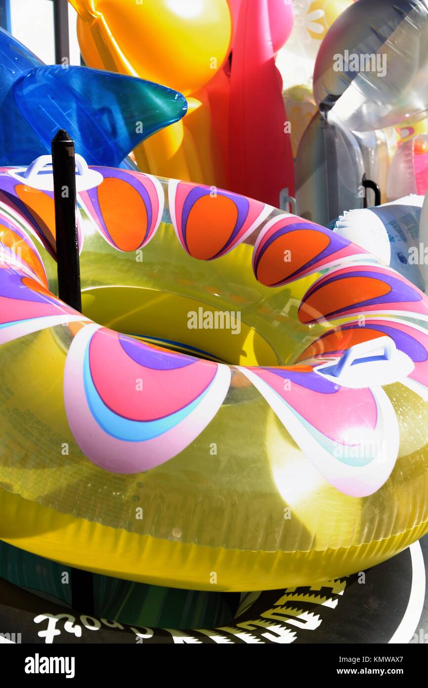 Multi coloured inflatables on sale at a beach shop Javea Costa Blanca