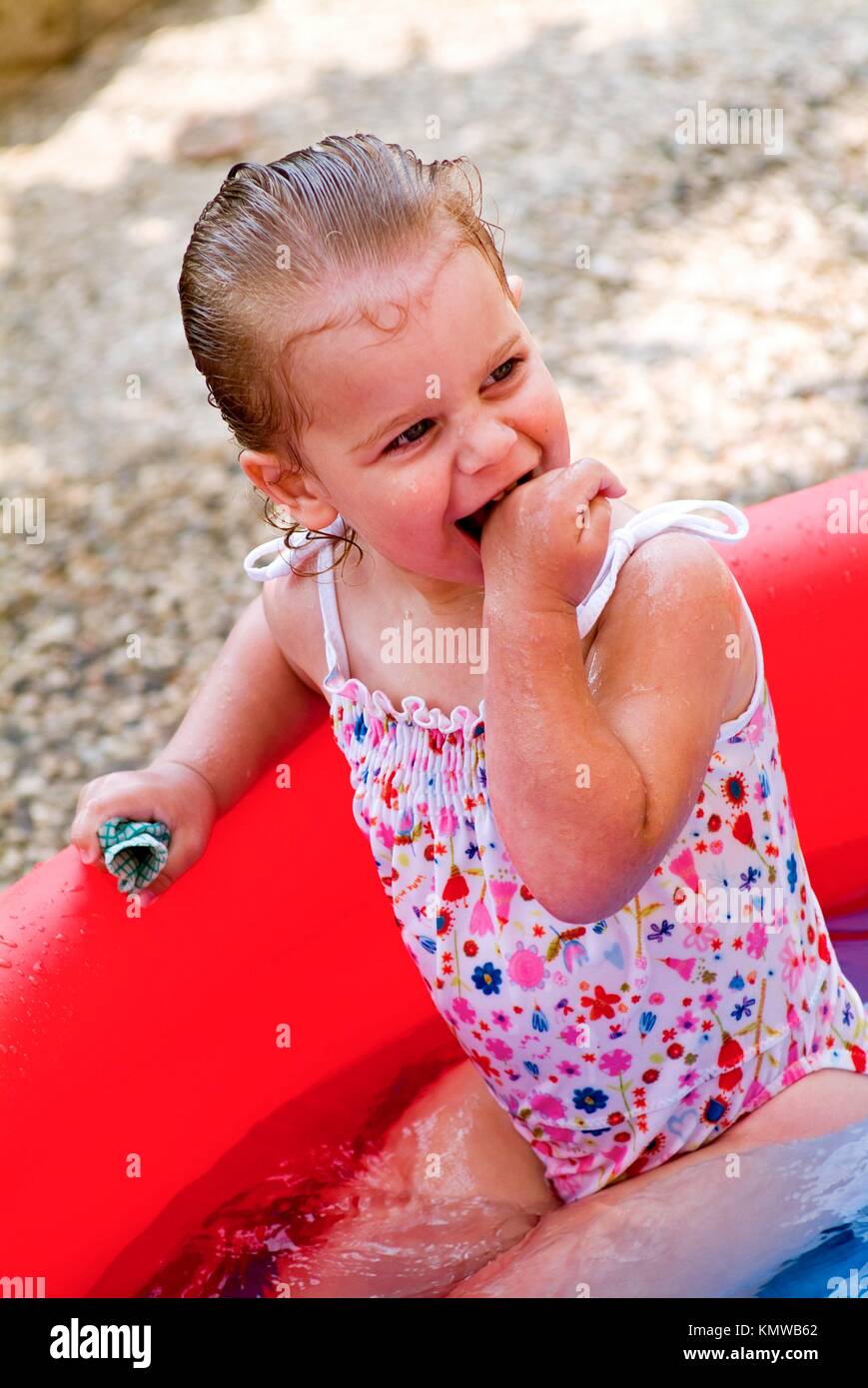 Child playing in a paddling pool Stock Photo Alamy
