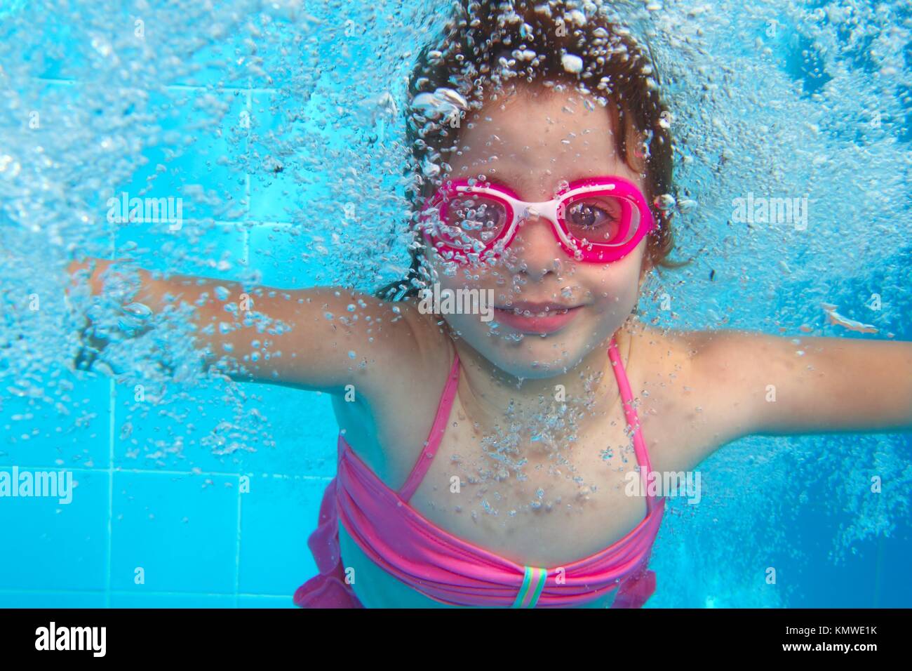 underwater little girl pink bikini goggles blue swimming pool ...
