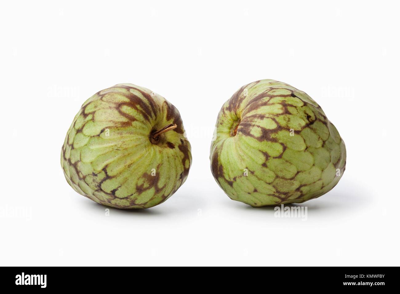 Pair of whole Cherimoya fruit isolated on white background Stock Photo