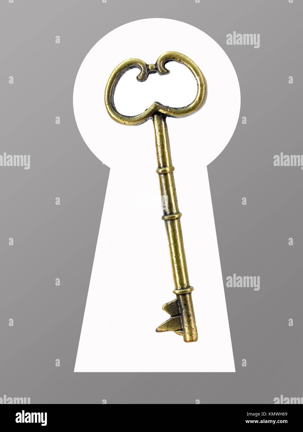 A vintage brass key isolated against a white background Stock Photo Alamy