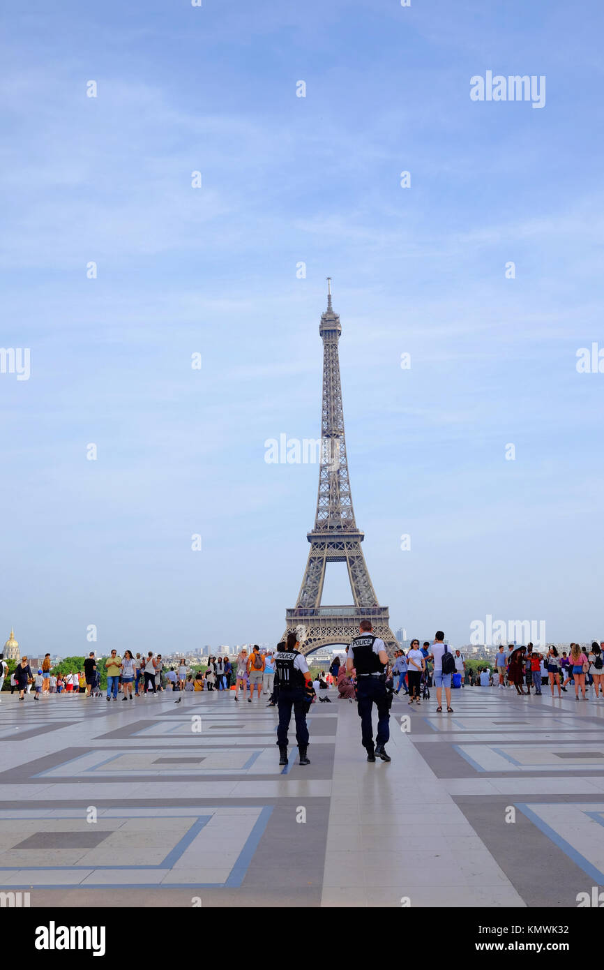 2 armed police officers patrol the Place Du Trocadero in front of the Eiffel Tower in Paris, in response to the increased terror threat Stock Photo