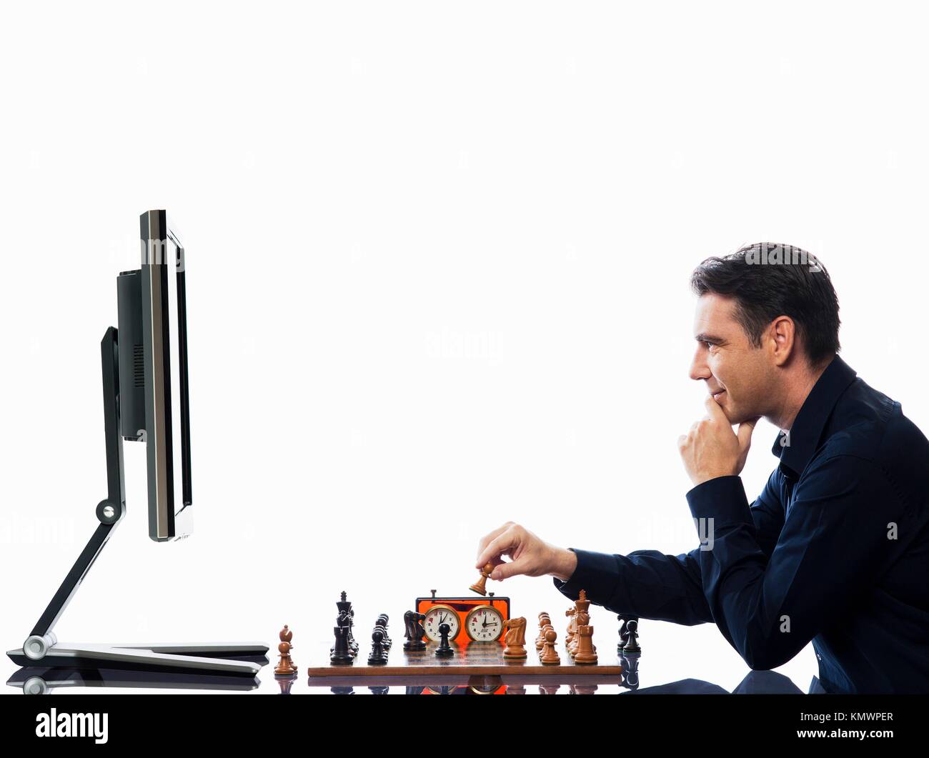 Caucasian man playing chess computer hi-res stock photography and