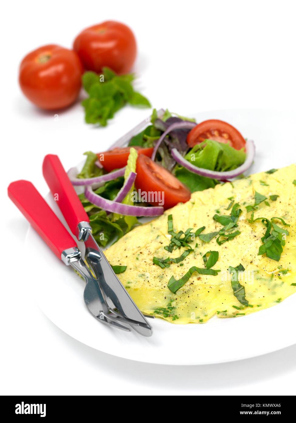 A freshley cooked herb omelette on a plate Stock Photo Alamy