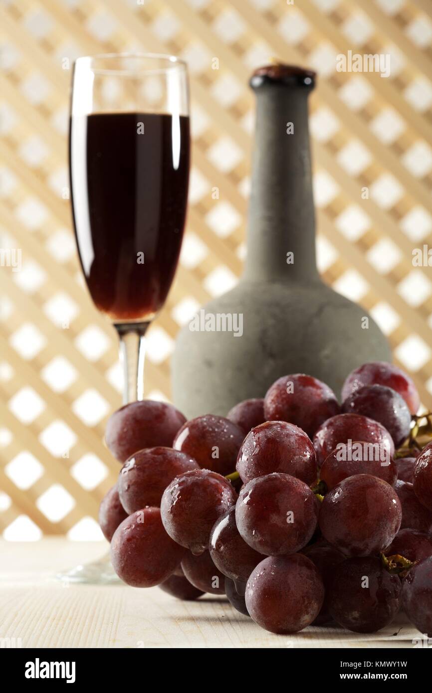 still life with old red wine and grape Stock Photo Alamy
