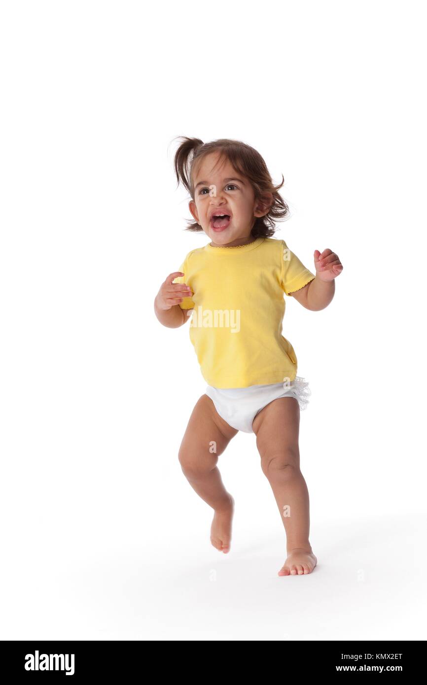 Baby girl jumping around Stock Photo Alamy