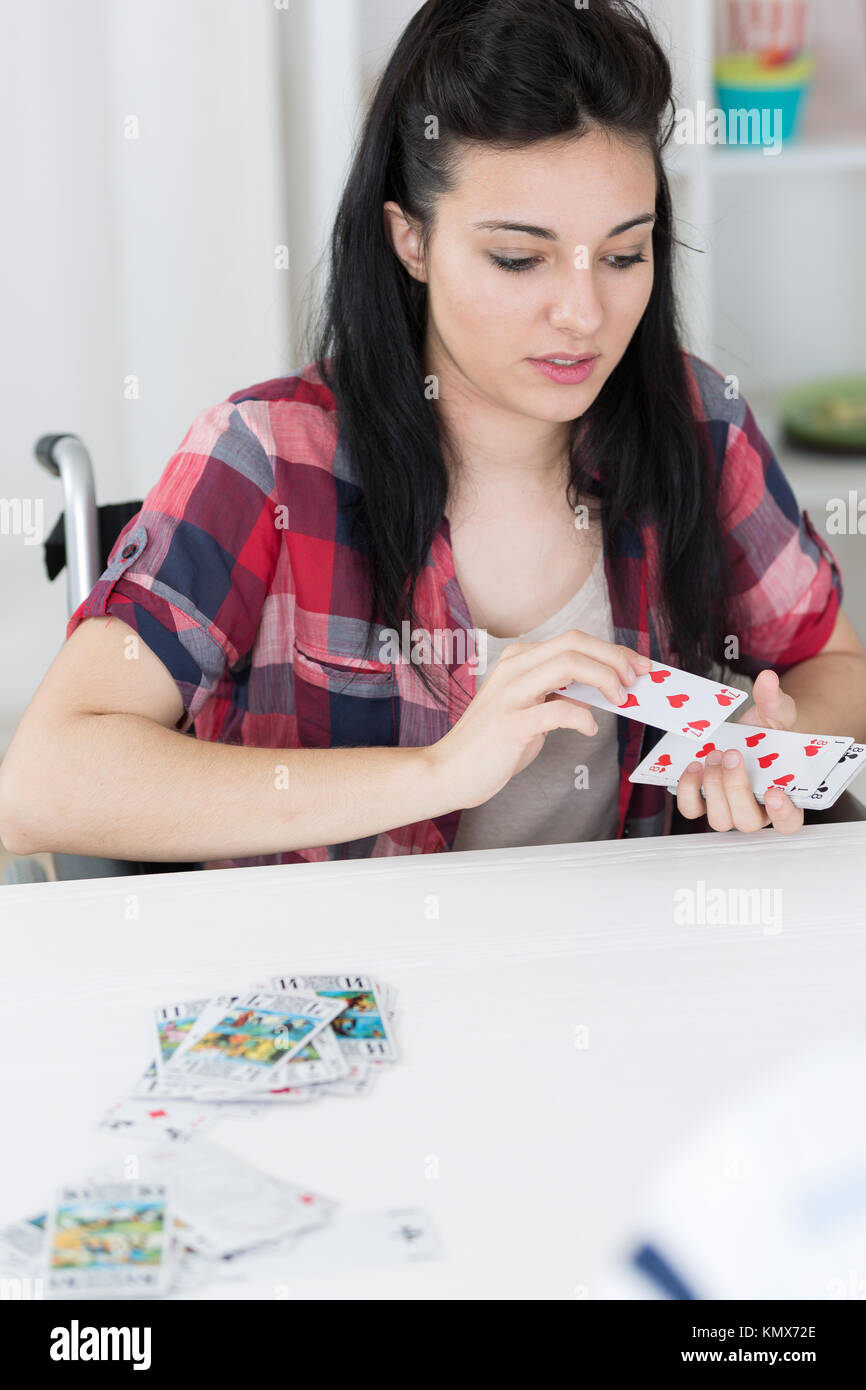 disabled young woman playing card game Stock Photo Alamy