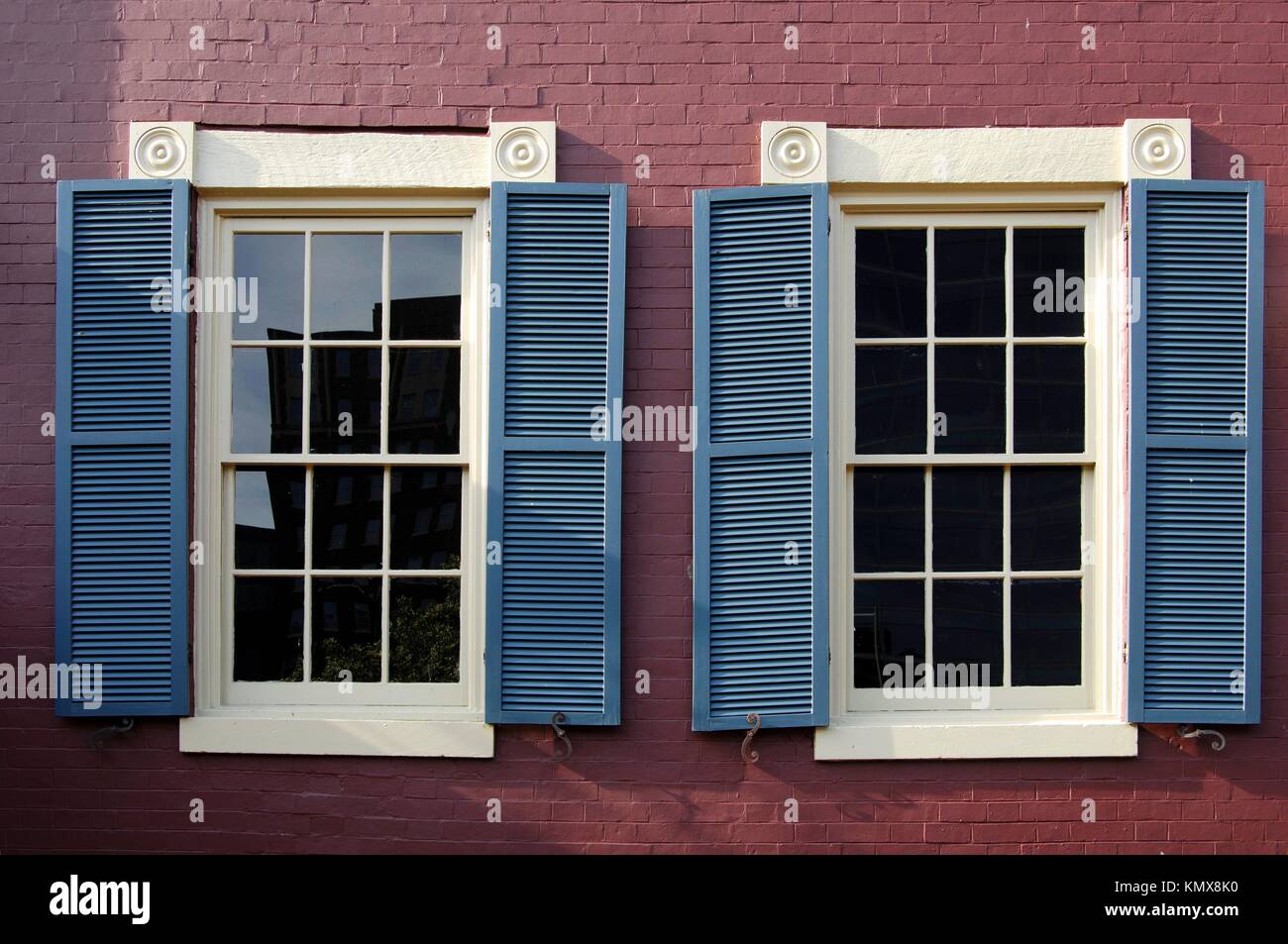 Windows of a historical brick house in the Red Lion Row, historic row houses from the 19th century in Foggy Bottom, Washington, D C , USA Stock Photo