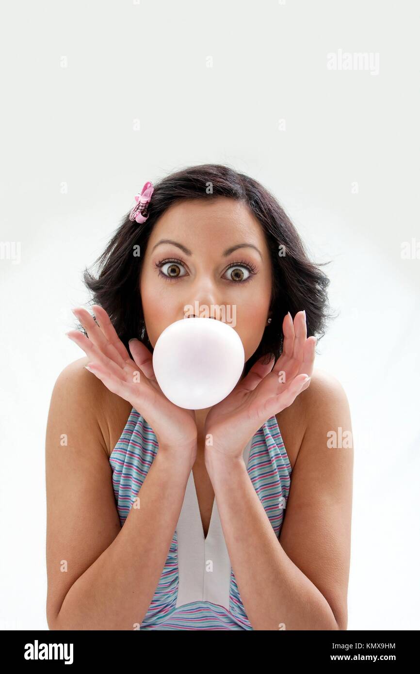 Woman blowing big bubble gum hi-res stock photography and images - Alamy