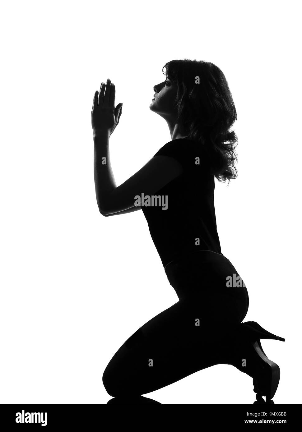 Woman kneeling silhouette hi-res stock photography and images - Alamy