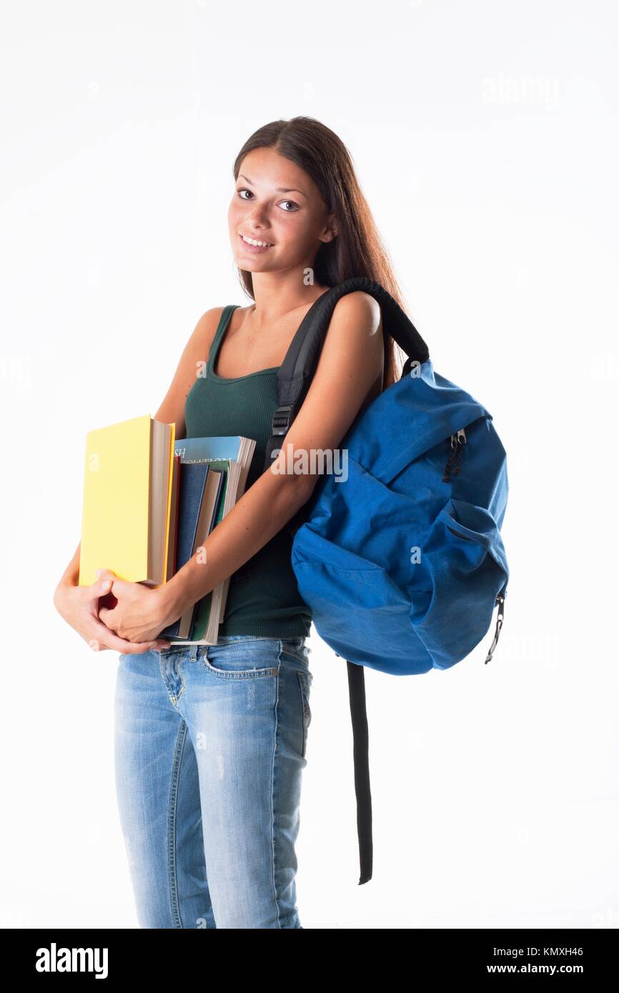 Female student carrying a heavy schoolbag Stock Photo