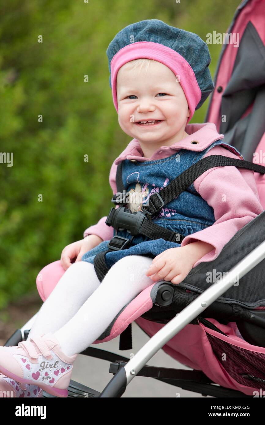 portrait of toddler sitting in a pram Stock Photo Alamy
