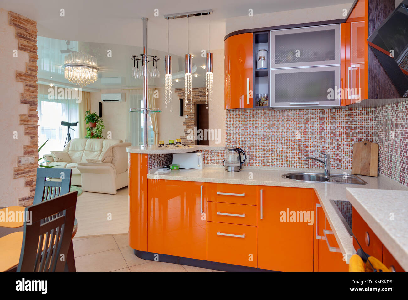 bright modern kitchen overlooking a drawing room with a window Stock ...