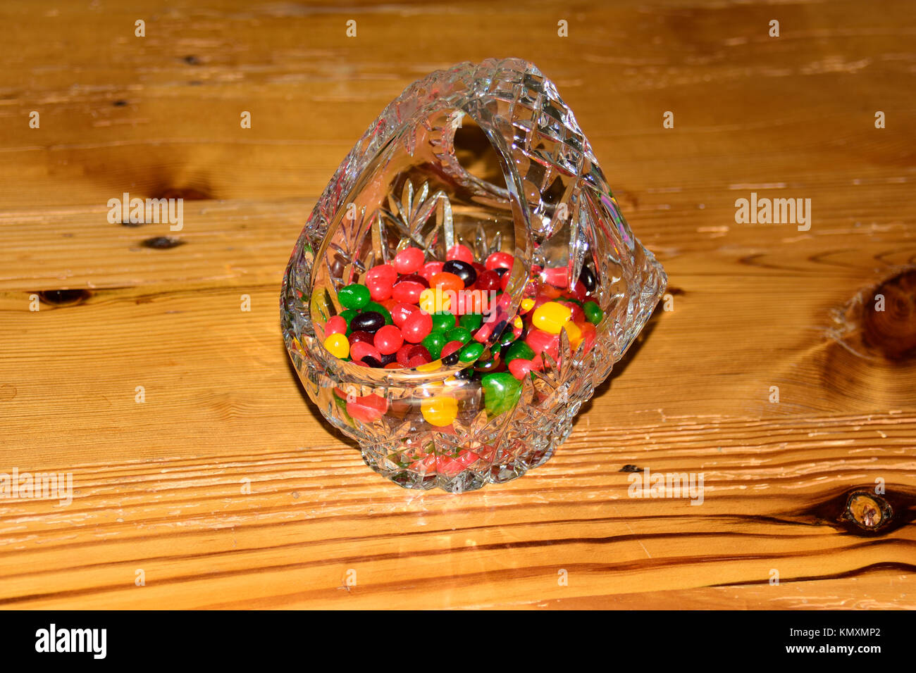 Chocolate Easter eggs in bright colours, on this beautiful wooden table