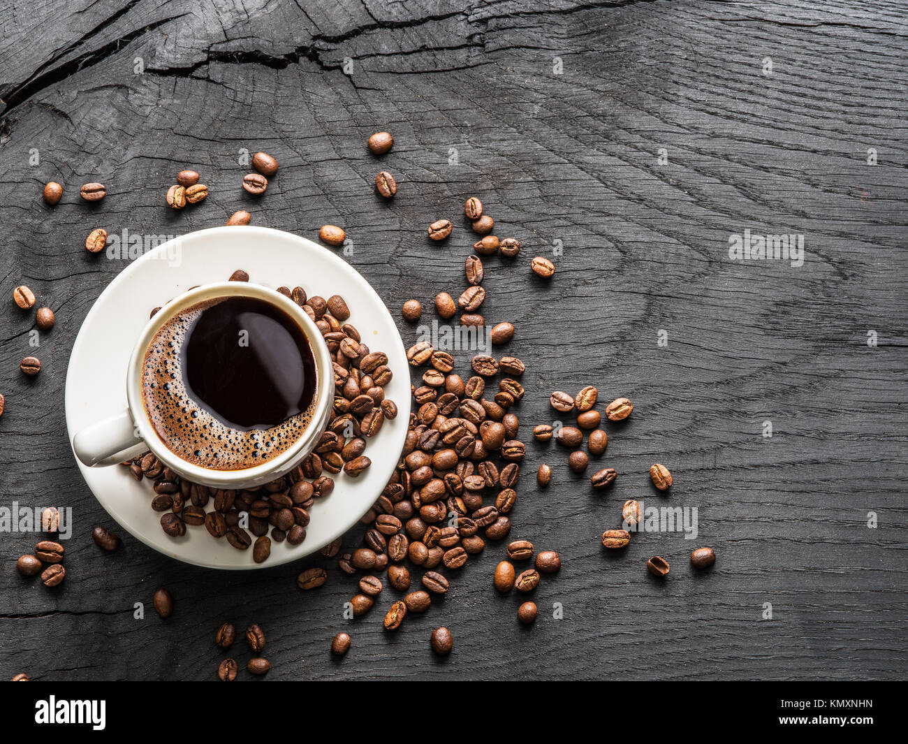 Cup of coffee surrounded by coffee beans. Top view Stock Photo - Alamy
