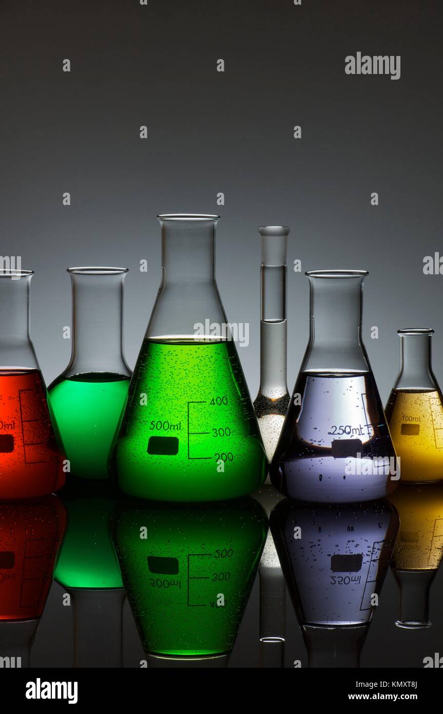 group of laboratory flasks containing liquid color Stock Photo Alamy