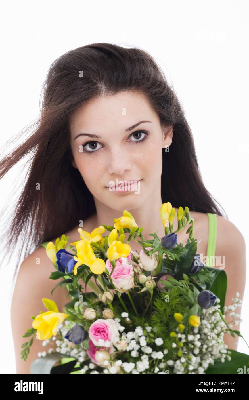 Beauty with a bunch of flowers Stock Photo