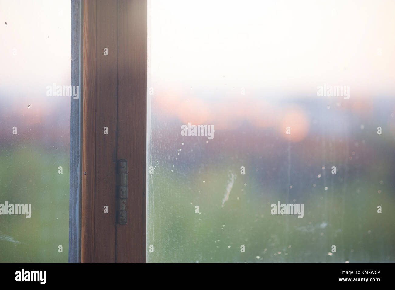 blurred image of a city through window. sunrise Stock Photo - Alamy