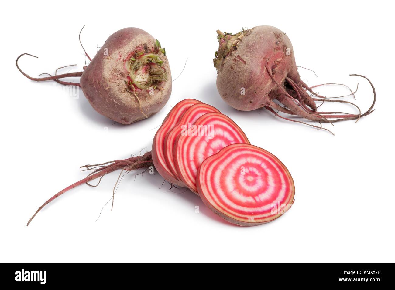 Whole chioggia beets and slices on white background Stock Photo