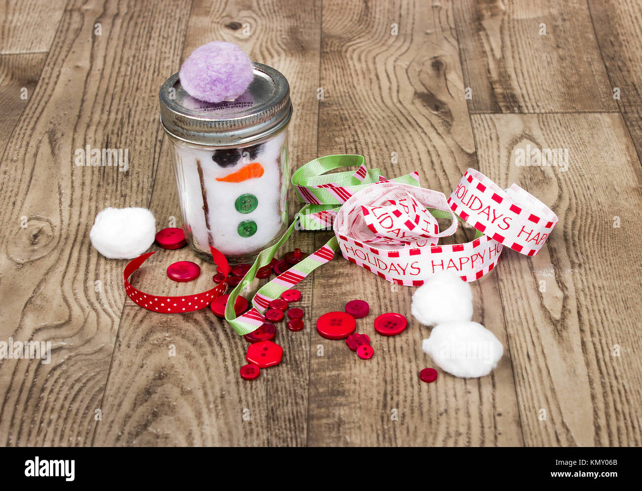 christmas background with ribbons,homemade snowman jar, buttons and ...