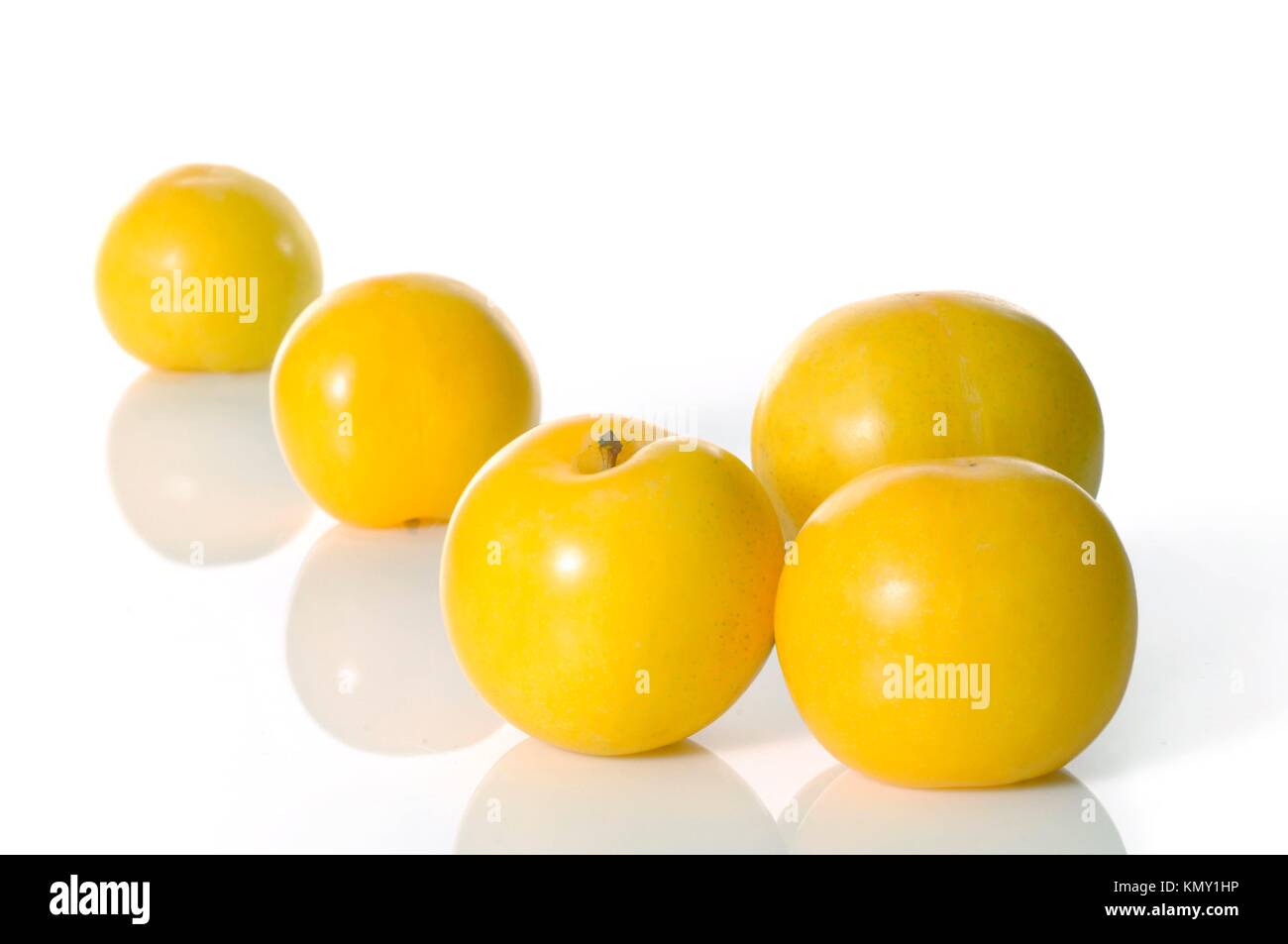 Fresh yellow plums on white background Stock Photo Alamy