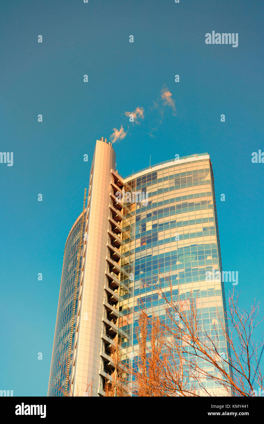 Glass office building in the rays of sunset Stock Photo - Alamy