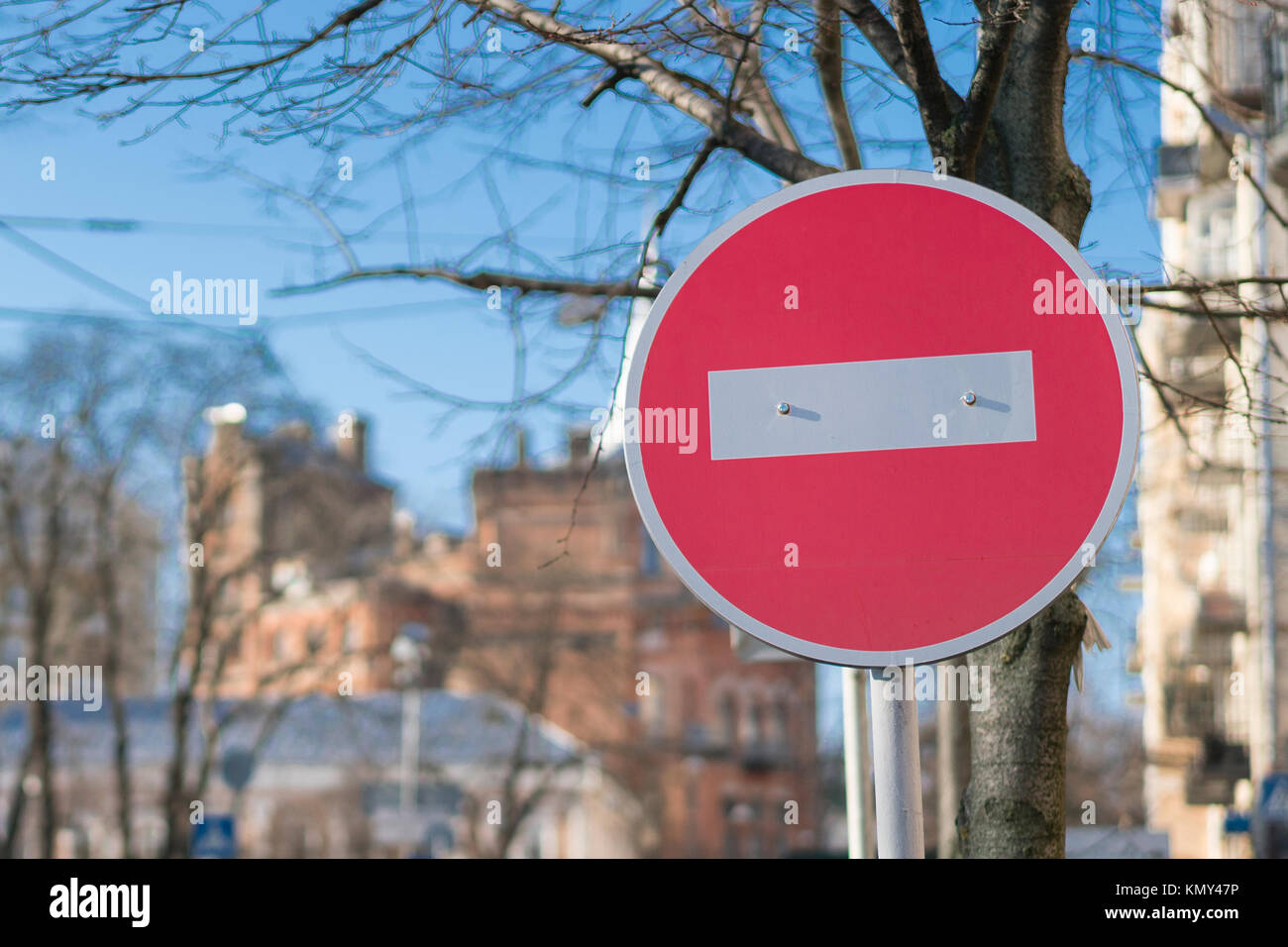 Round red road sign on metal pole. No Entry road-sign mounted on urban ...