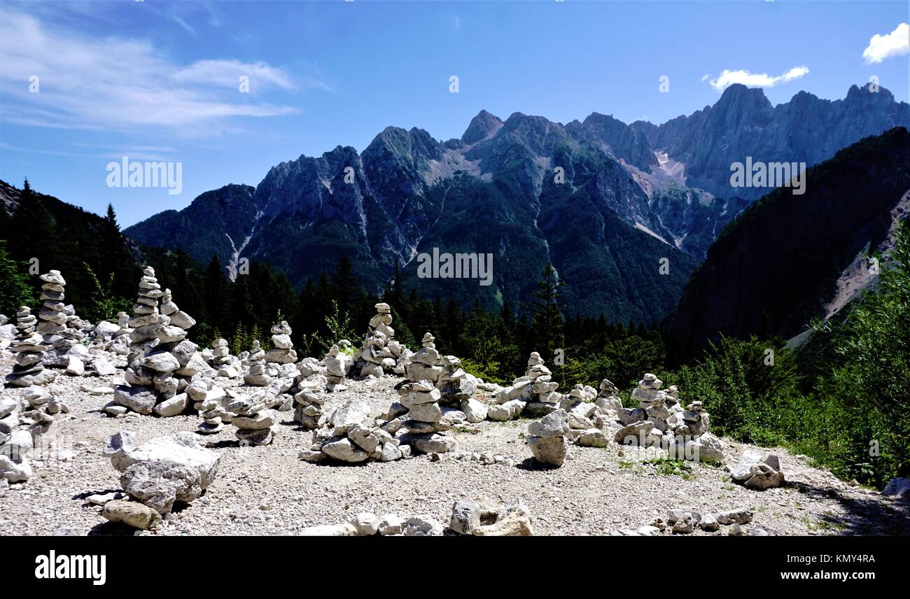Vrsic pass with stone piles and Triglav mountains, Slovenia Stock Photo