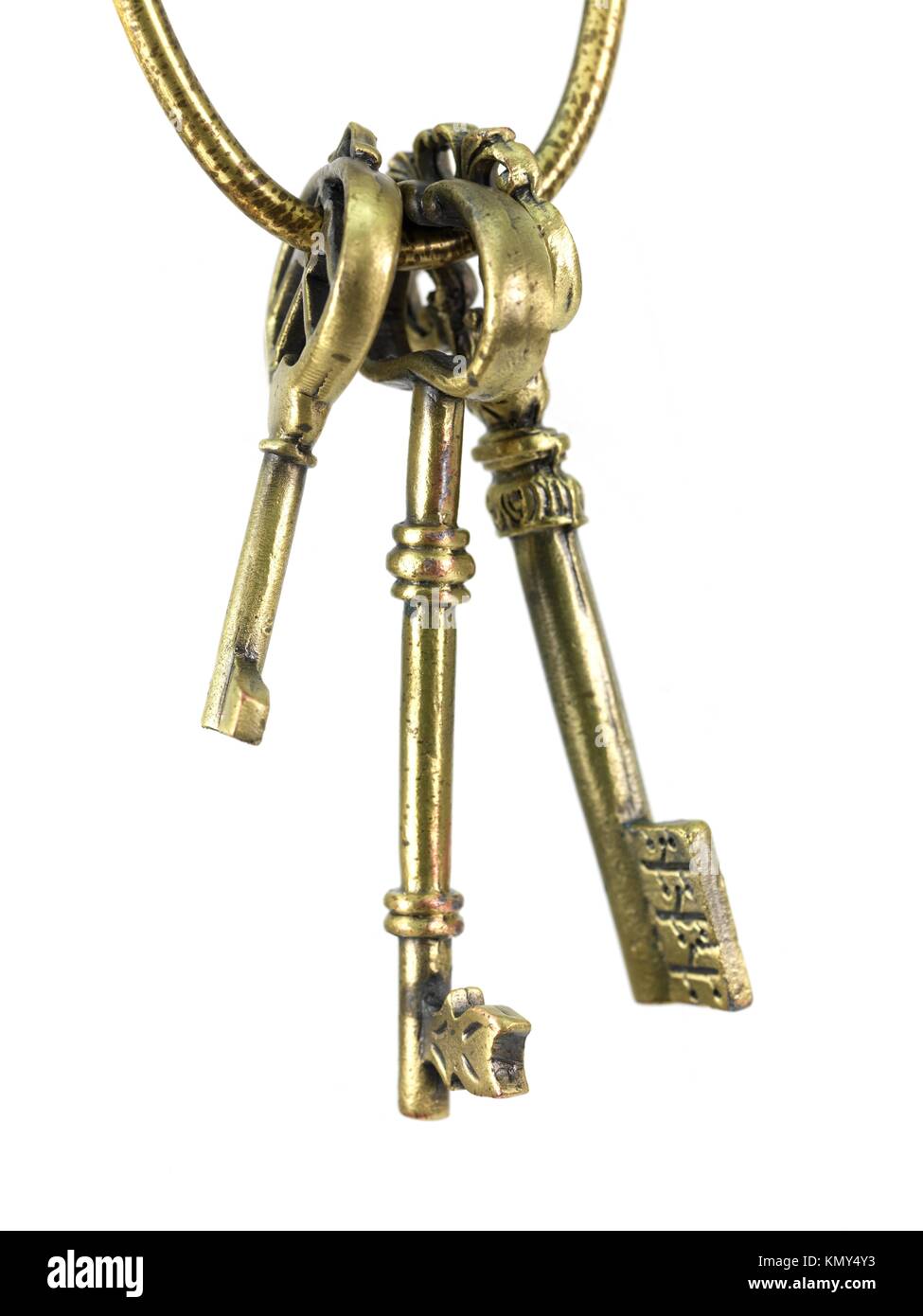 Vintage brass keys isolated against a white background Stock Photo Alamy