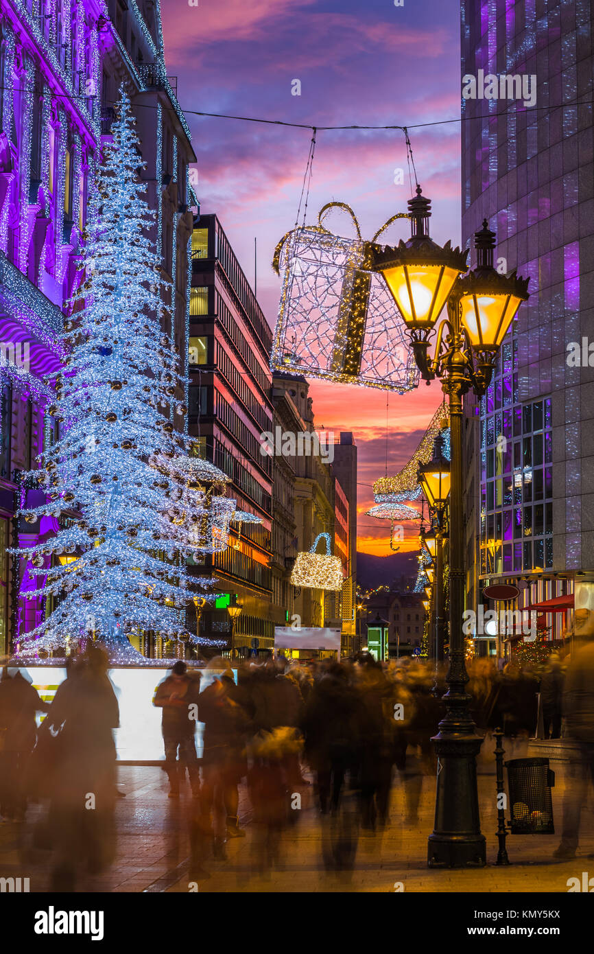 Budapest, Hungary Glowing Christmas tree and tourists on the busy