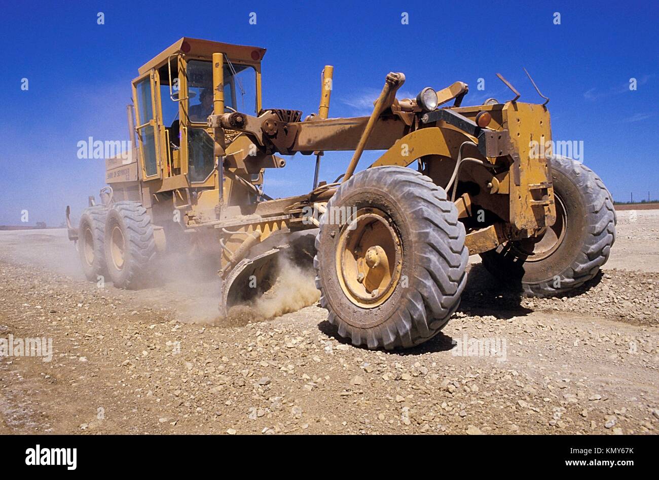large earth mover grading an outback road Stock Photo Alamy
