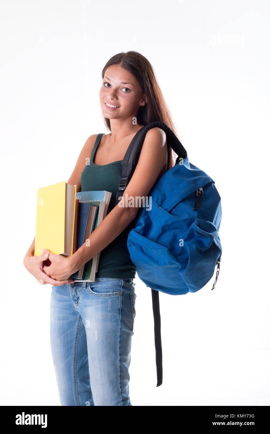 Female student carrying a heavy schoolbag Stock Photo