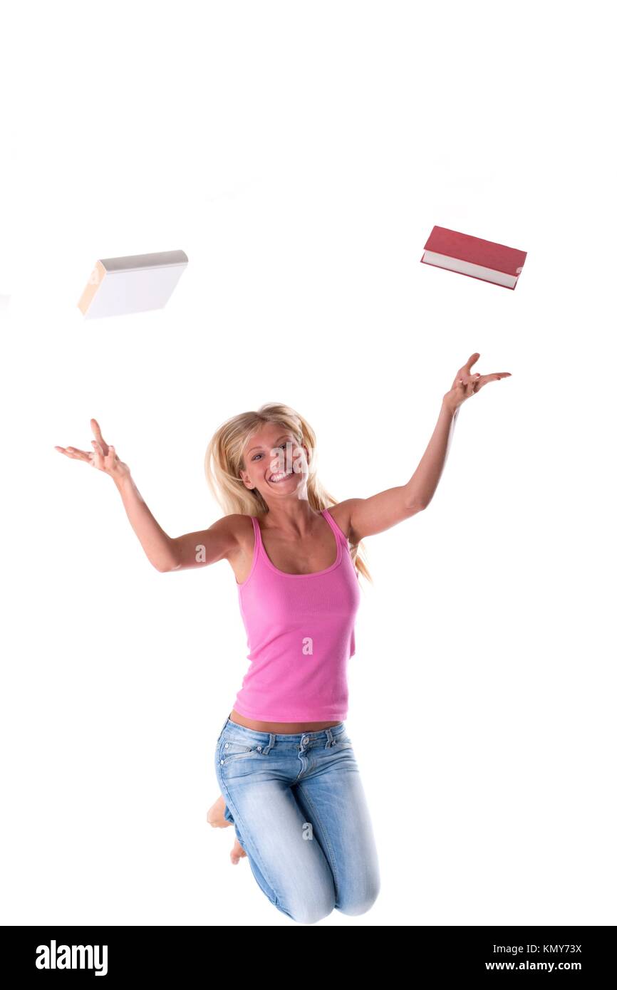 Happy student jumping, throwing books away  Concept: end of school Stock Photo