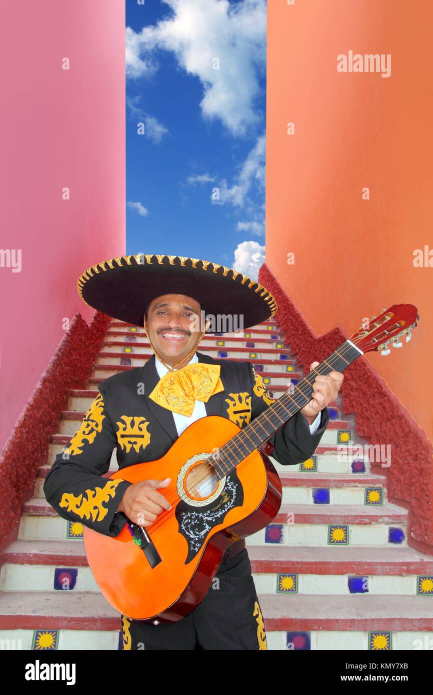 Charro Mariachi singer playing guitar in Mexico stairway Stock Photo ...