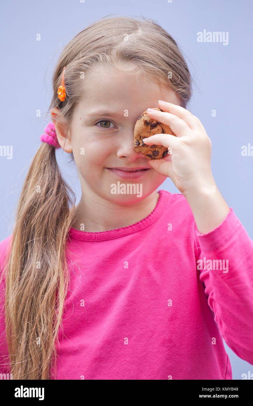 7 year old girl eating snack hires stock photography and images Alamy