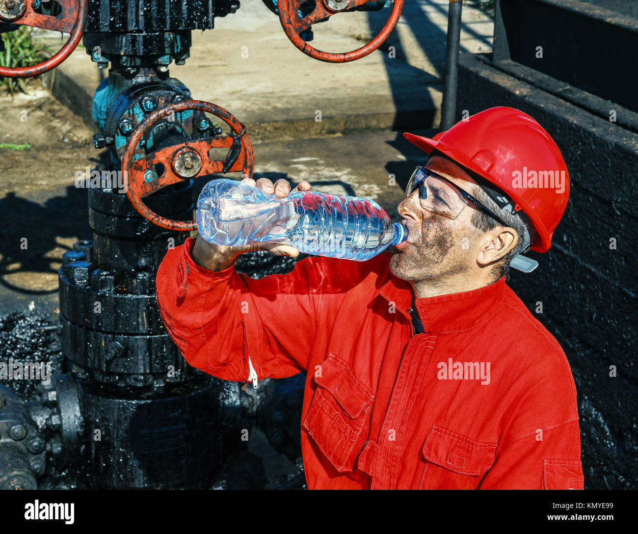 Wearing red coveralls hi-res stock photography and images - Alamy