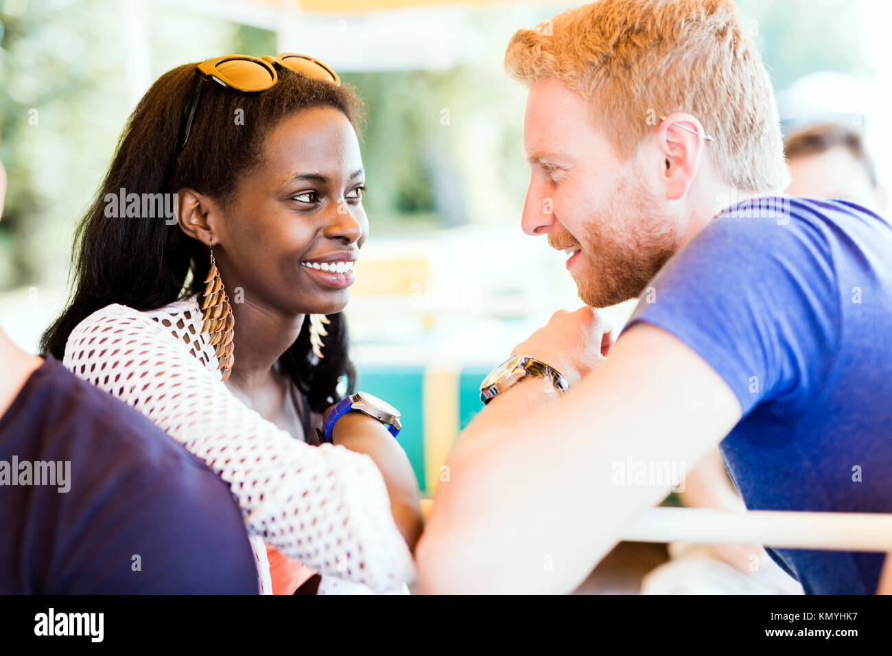 Romantic couple smiling while looking into each others eyes Stock Photo ...