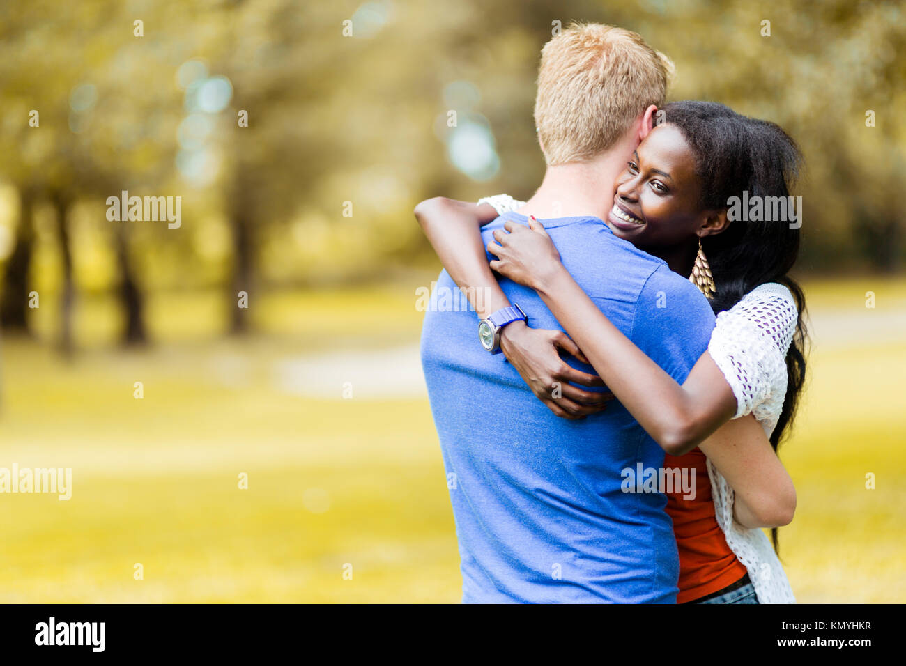 Couple in love hugging peacfully outdoors Stock Photo