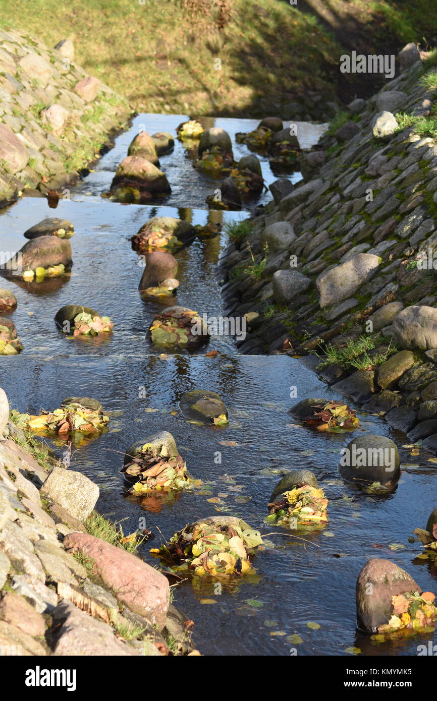 Pebbles and rocks in a stream Stock Photo