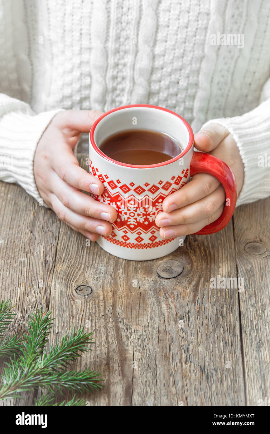 https://c8.alamy.com/comp/KMYMXT/female-hands-holding-red-mug-of-hot-chocolate-coffee-tea-cacao-on-KMYMXT.jpg