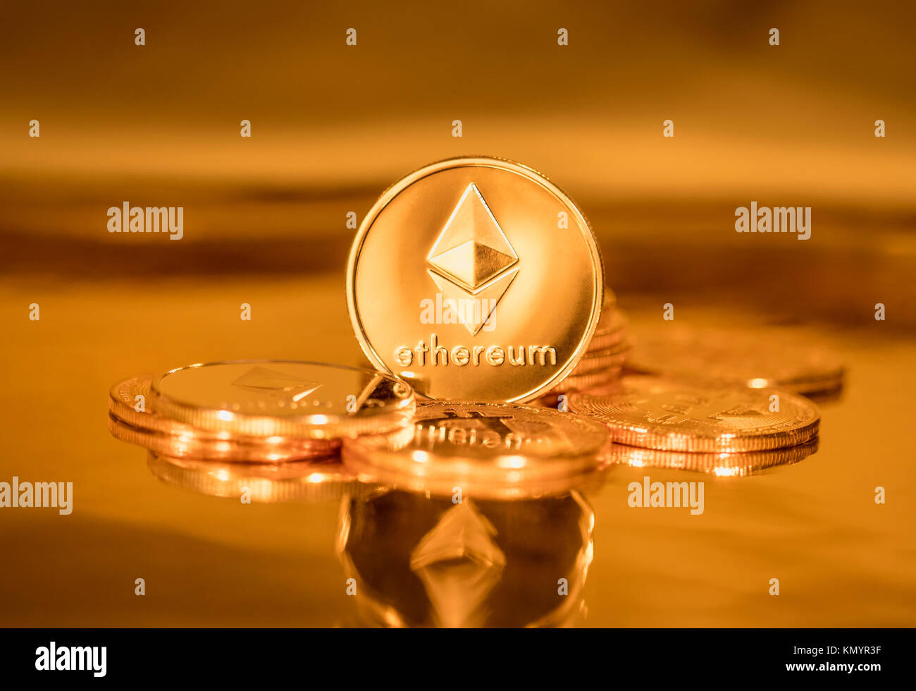 Golden coins with the symbol of the digital crypto currency Ethereum Stock Photo
