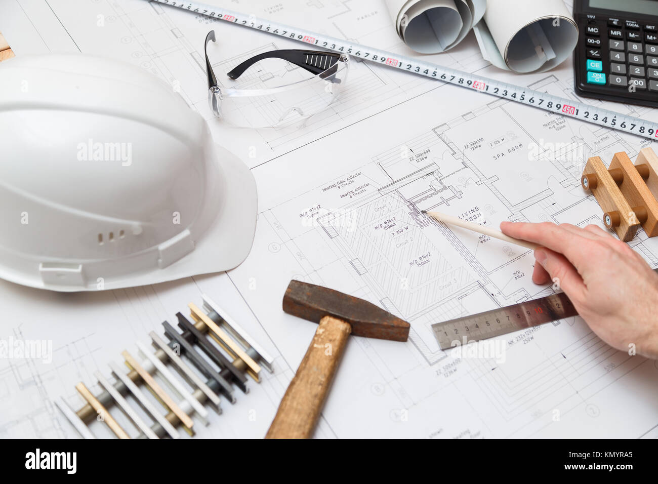 Concept architects or engineer holding pencil pointing equipment